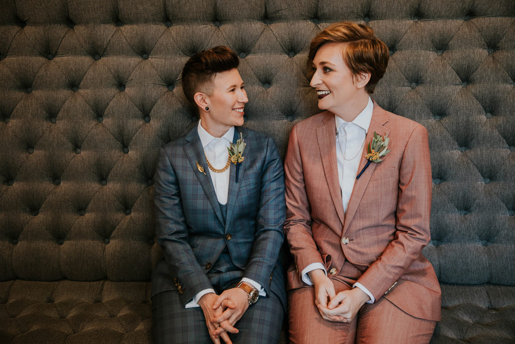 Keili and Cori wearing suits on their wedding day.